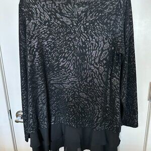 Ladies sparkly black dressy top size Med with Nylon double ruffle at bottom